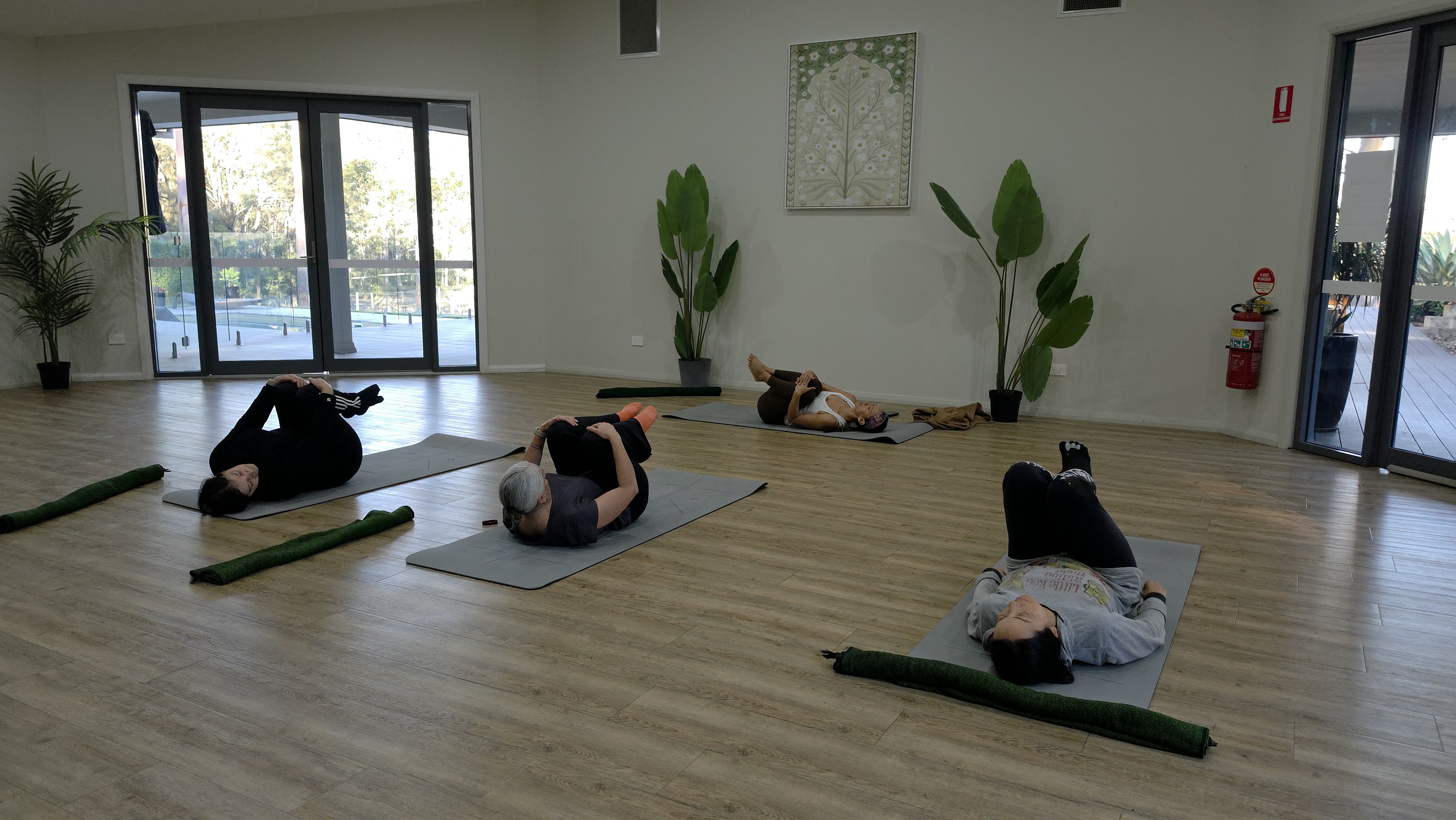 People practising breathwork and nervous system regulation in a calm indoor studio